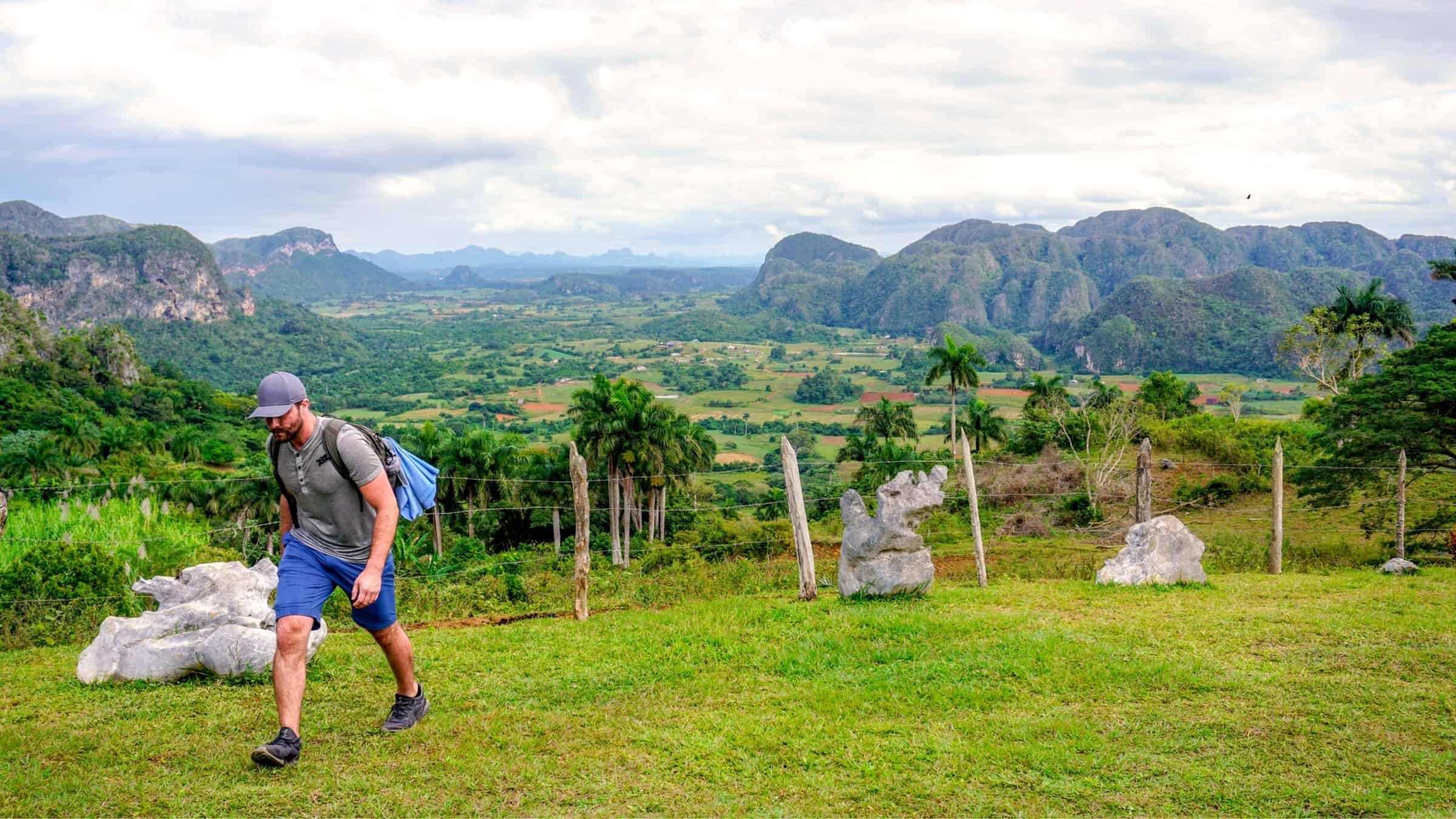 walker climbing a mogote, Vinales Valley , Cuba 